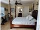 Spacious bedroom with a four-poster bed and an en-suite bathroom at 10161 Culpepper Ct, Orlando, FL 32836