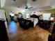 Large main bedroom features tiled floor, tray ceiling, dark wood furnishings, sitting area and plenty of natural light at 10161 Culpepper Ct, Orlando, FL 32836