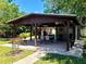 This property features a spacious outdoor space with a covered pavilion and seating area, perfect for entertaining or relaxing at 10161 Culpepper Ct, Orlando, FL 32836