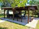 This property features a spacious outdoor space with a covered pavilion and seating area, perfect for entertaining at 10161 Culpepper Ct, Orlando, FL 32836