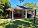 Covered patio boasts tiled flooring, plenty of room for seating, and great outdoor space at 10161 Culpepper Ct, Orlando, FL 32836