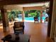 Tile patio leading to a sparkling pool and lush landscaping, ideal for relaxation and entertaining at 10161 Culpepper Ct, Orlando, FL 32836