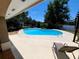Inviting kidney-shaped pool with a sunny deck, perfect for enjoying the outdoors at 10161 Culpepper Ct, Orlando, FL 32836