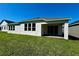 This home features a covered patio and a well-maintained lawn, perfect for outdoor enjoyment and relaxation at 329 Lady Palm St, Apopka, FL 32703