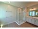 Modern bathroom features a glass-enclosed shower, sleek vanity, and stylish fixtures for a spa-like experience at 329 Lady Palm St, Apopka, FL 32703