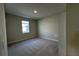 Bright bedroom with a window and neutral carpeting at 329 Lady Palm St, Apopka, FL 32703