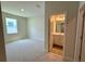 Bedroom view featuring attached bathroom with large window at 329 Lady Palm St, Apopka, FL 32703
