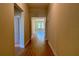 Hallway featuring wood-look tile flooring and access to other rooms in the home at 329 Lady Palm St, Apopka, FL 32703
