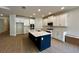 Modern kitchen with island and tile flooring at 329 Lady Palm St, Apopka, FL 32703