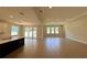 Bright and airy living area with tile floors, recessed lighting, and access to the outdoor living space at 329 Lady Palm St, Apopka, FL 32703