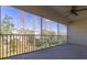 Screened balcony with ceiling fan and nature views at 5058 Maxon S Ter # 108, Sanford, FL 32771