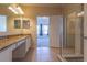Bathroom with vanity, tile floor, and access to bedroom at 5058 Maxon S Ter # 108, Sanford, FL 32771