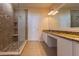 Bathroom boasts double vanity, granite countertop, and large shower at 5058 Maxon S Ter # 108, Sanford, FL 32771