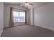 Bright bedroom with carpeted floor, large window, and ceiling fan at 5058 Maxon S Ter # 108, Sanford, FL 32771