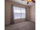 Bright bedroom with large window, ceiling fan and neutral decor at 5058 Maxon S Ter # 108, Sanford, FL 32771