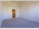 Primary bedroom with carpet, door to bathroom, and neutral walls at 5058 Maxon S Ter # 108, Sanford, FL 32771