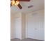 Bedroom with double door closet and ceiling fan at 5058 Maxon S Ter # 108, Sanford, FL 32771