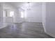 Spacious dining area with gray vinyl flooring and chandelier at 5058 Maxon S Ter # 108, Sanford, FL 32771