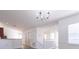 Open dining area with gray flooring and a chandelier at 5058 Maxon S Ter # 108, Sanford, FL 32771