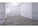 Bright dining room featuring gray vinyl flooring and chandelier at 5058 Maxon S Ter # 108, Sanford, FL 32771