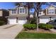 Two-story townhome with two-car garage and manicured landscaping at 5058 Maxon S Ter # 108, Sanford, FL 32771