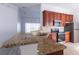 Modern kitchen with granite countertops and stainless steel appliances at 5058 Maxon S Ter # 108, Sanford, FL 32771