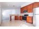 Modern kitchen with granite countertops and stainless steel appliances at 5058 Maxon S Ter # 108, Sanford, FL 32771