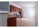 Modern kitchen with granite countertops and stainless steel appliances at 5058 Maxon S Ter # 108, Sanford, FL 32771