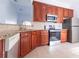 Modern kitchen with granite countertops and stainless steel appliances at 5058 Maxon S Ter # 108, Sanford, FL 32771