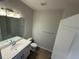 Clean bathroom featuring a single sink vanity, toilet, and towel bar at 791 Pilea St, Apopka, FL 32703