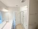 Bright bathroom featuring a glass shower and double sink vanity at 791 Pilea St, Apopka, FL 32703