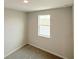 Cozy carpeted bedroom with a window providing natural light and views at 791 Pilea St, Apopka, FL 32703