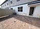 Brick-paved patio with white fence and access door at 791 Pilea St, Apopka, FL 32703