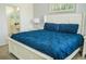 Cozy bedroom with a king bed, white furniture and an ensuite bathroom at 2621 Calistoga Ave, Kissimmee, FL 34741