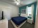 Comfortable bedroom with queen bed, closet, and modern dresser at 2621 Calistoga Ave, Kissimmee, FL 34741
