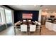 Dining area with table set for ten, stainless steel appliances, and pool view at 2621 Calistoga Ave, Kissimmee, FL 34741