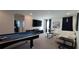 Fun game room with a billiards table, TV, and comfortable seating at 2621 Calistoga Ave, Kissimmee, FL 34741