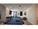 Entertaining game room with a pool table, TV, and comfortable seating area at 2621 Calistoga Ave, Kissimmee, FL 34741