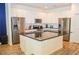 Bright open kitchen featuring stainless appliances, granite countertops, and central island at 2621 Calistoga Ave, Kissimmee, FL 34741