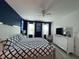 Bright main bedroom with king bed and ensuite bathroom, featuring large windows and modern décor at 2621 Calistoga Ave, Kissimmee, FL 34741