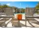 Comfortable poolside loungers with a fountain and modern architecture add a luxurious touch at 2621 Calistoga Ave, Kissimmee, FL 34741