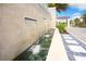 Elegant water feature with stone accents and lush landscaping creates a serene outdoor ambiance at 2621 Calistoga Ave, Kissimmee, FL 34741