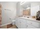 Bathroom with white vanity, shower/tub combo, and patterned shower curtain at 8162 Lazy Bear Ln, Winter Park, FL 32792