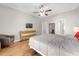 Spacious bedroom with hardwood floors and a dresser at 8162 Lazy Bear Ln, Winter Park, FL 32792