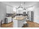Modern kitchen with stainless steel appliances and granite countertops at 8162 Lazy Bear Ln, Winter Park, FL 32792