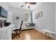 Home office with desk, chair, and comfortable couch at 8162 Lazy Bear Ln, Winter Park, FL 32792