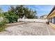 The backyard features a paved patio area with a fire pit and privacy fence at 1278 Snug Harbor Dr, Casselberry, FL 32707