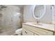 This bathroom features a marble shower, vanity, and updated fixtures at 1278 Snug Harbor Dr, Casselberry, FL 32707