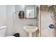 Cozy bathroom featuring a sink, mirror, shower and a towel rack at 1278 Snug Harbor Dr, Casselberry, FL 32707