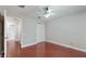An ample bedroom with hardwood floors, natural light, and neutral paint at 1278 Snug Harbor Dr, Casselberry, FL 32707